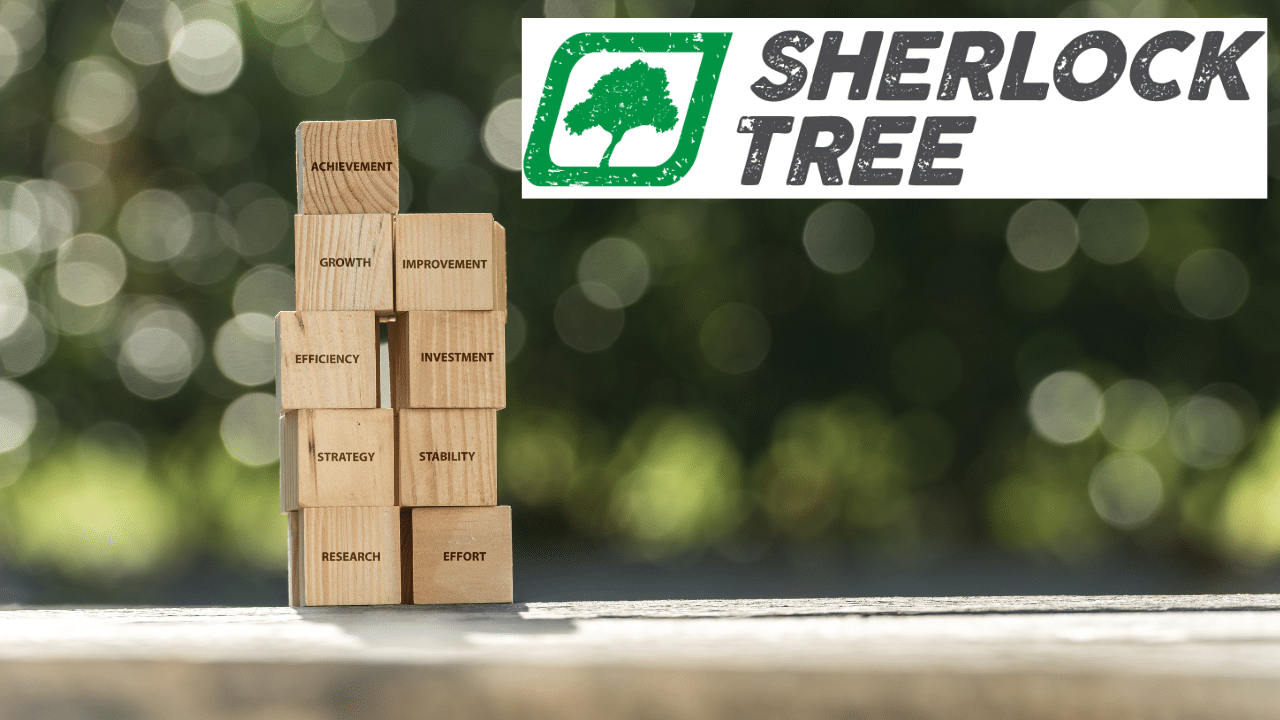 A stack of building blocks with business-oriented words against a green background. The logo for Sherlock Tree Company is in the top right corner.